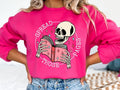 Book & Skull Graphic with Spread Those Pages Gildan Sweatshirt in Heliconia T-Shirts, Hoodie | PureTeeCo.com