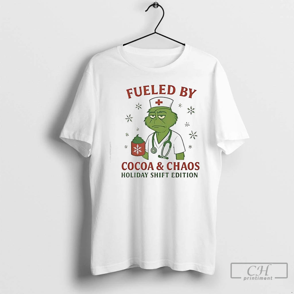 Classic Grinch Green Fueled By Cocoa Chaos Holiday Shift Edition Nurse T-Shirts, Hoodie, Sweatshirt | PureTeeCo.com