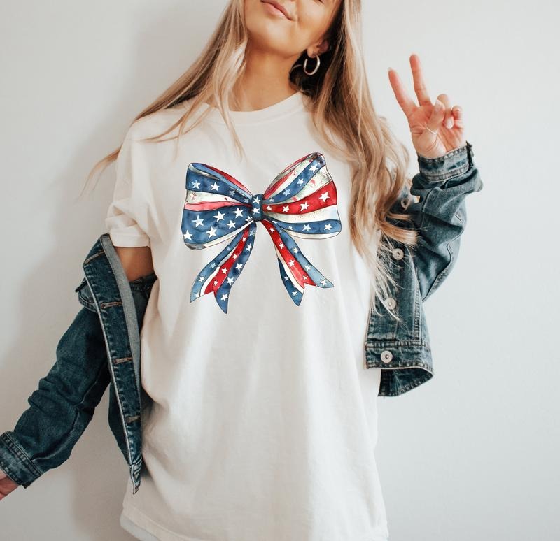 Coquette America Bow Shirt, USA Shirt, 4th of July shirt, Patriotic Memorial Day shirt, American Flag Bow, Women's Shirt...