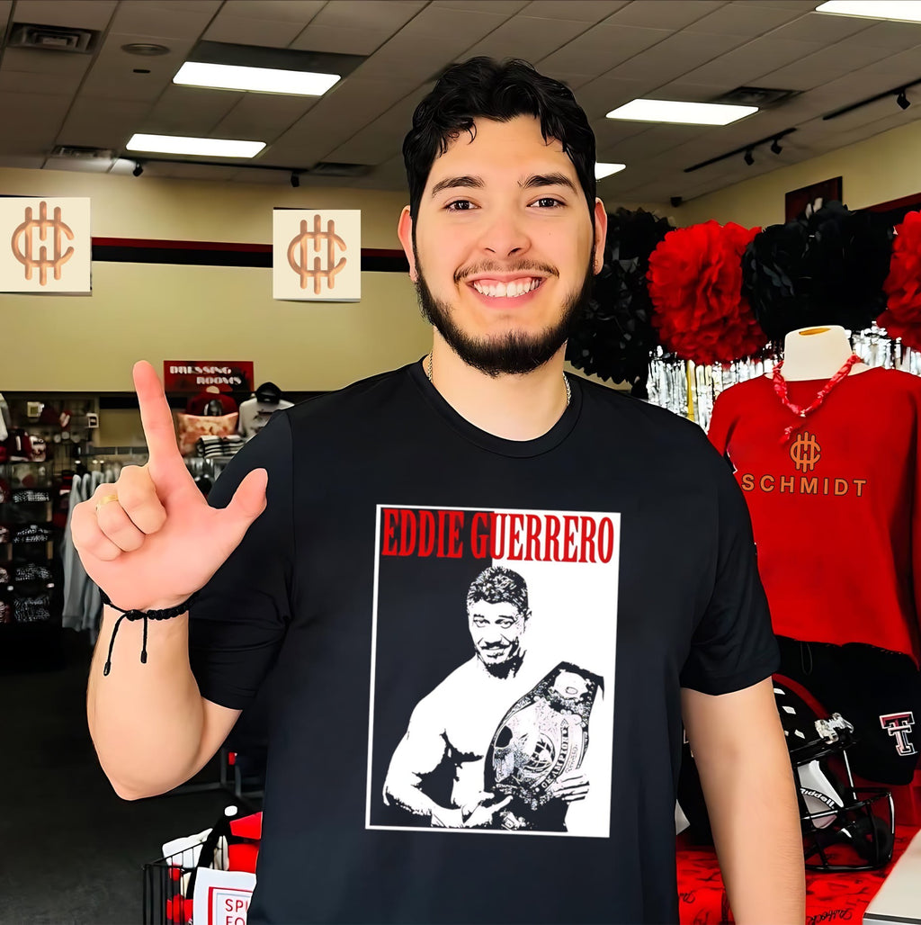 Eddie Guerrero holding championship belt shirt