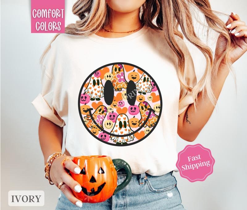 Halloween Happy Face Shirt Comfort Colors, Cute Ghost Tshirt for Women,  Spooky Season Shirt Oversized Crewneck Tee...