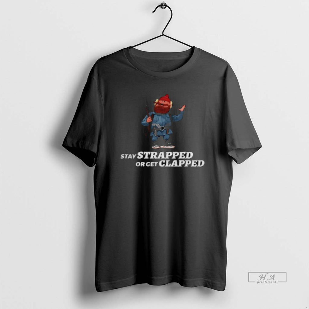 Official Yukon Cornelius Stay Strapped Or Get Clapped T-Shirts, Hoodie, Sweatshirt | PureTeeCo.com