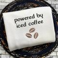Powered by Iced Coffee Embroidered Sweatshirt, Coffee Beans Black and Cream Sweatshirt, Gift for Coffee Lover T-Shirts,...