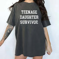Teenage Daughter Survivor Shirt, Funny Graphic Printed Tee For Dad, Daughter's Mother Unhinged Shirt, Funny Parents Tee,...