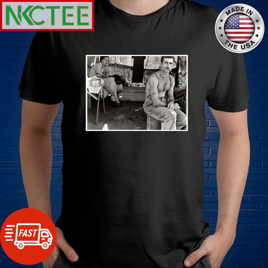 Unemployed lumber worker goes with his wife to the bean harvest. Note Social Security number tattooed on his arm. Oregon, August 1939 shirt