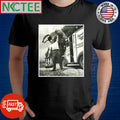 Weightlifter holding a man over his head in 1947 shirt