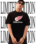 Drake wearing Dilla Lives Detroit Red Wings shirt