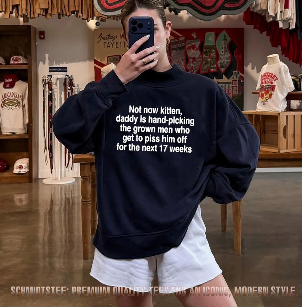 Not now kitten daddy is hand picking the grown men shirt