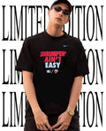 Thomas White wearing Shrimpin’ ain’t easy Jacksonville Jumbo Shrimp shirt