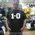 Giants Coach John Harbaugh Wearing 1-0 shirt