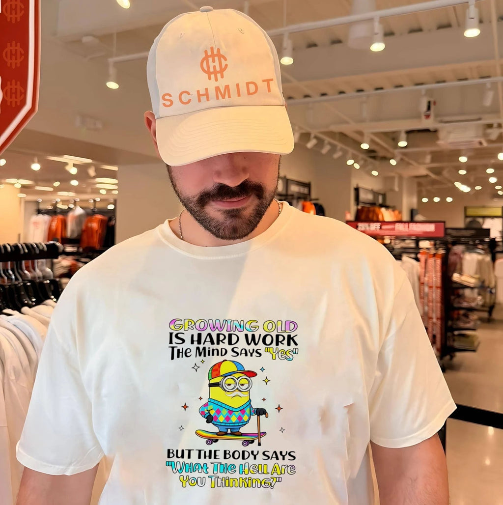 Growing old is hard work the mind says yes but the body says what the heilate you thinking Minion shirt